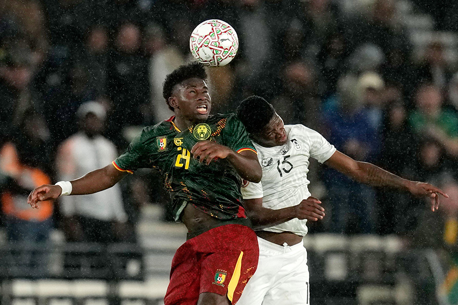Cameroon's Carlos Baleba, left, and South Africa's Bathusi Aubaas challenge for the ball during the Africa Cup of Nations round of 16 soccer match between South Africa and Cameroon